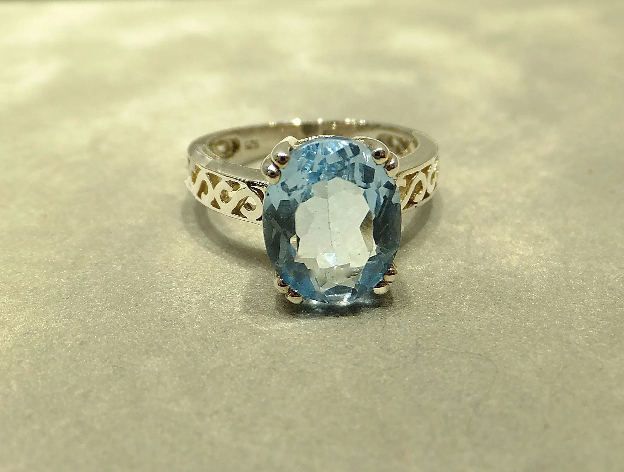 Oval Solitaire Blue Topaz Gemstone Ring In Sterling Silver